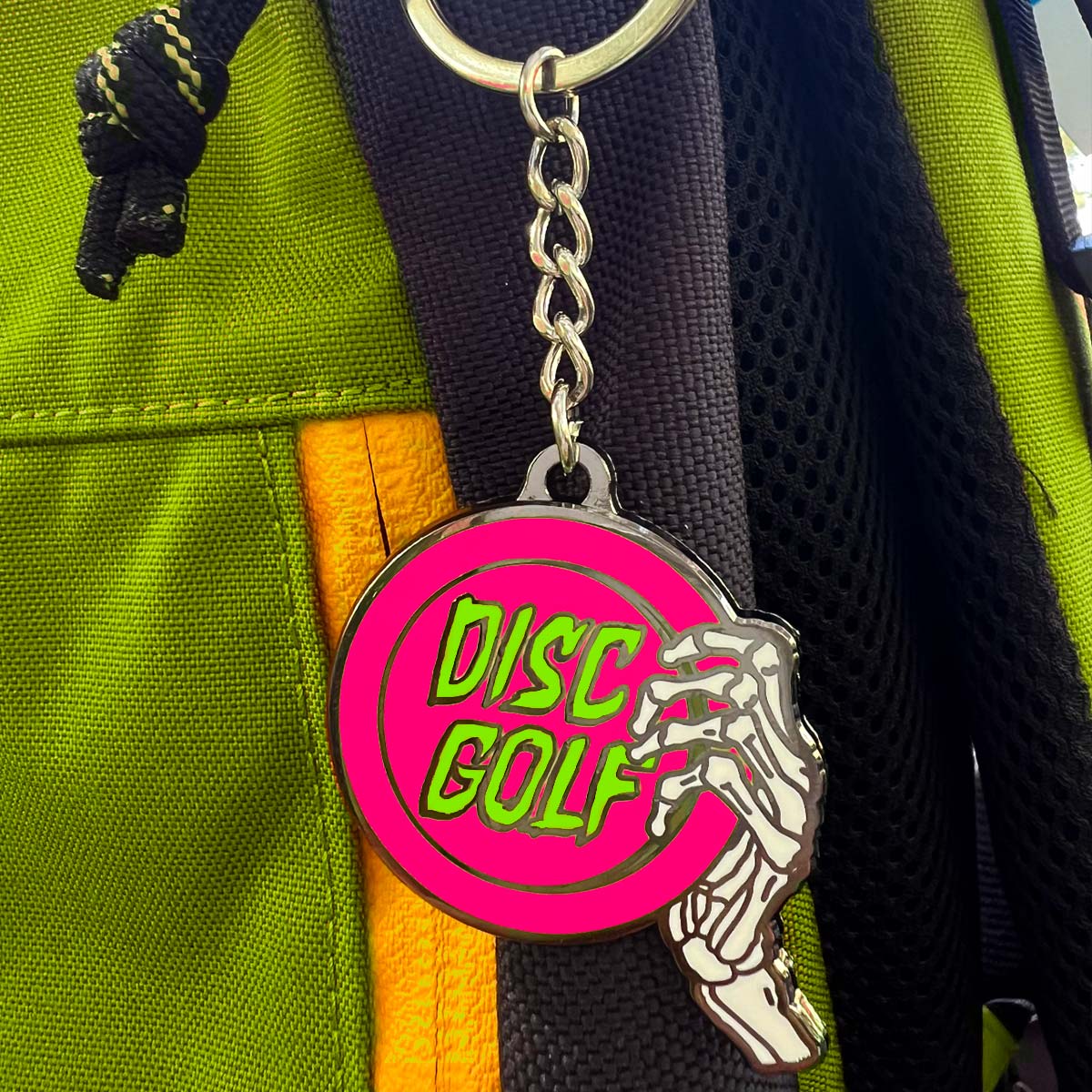 Disc Golf Pins | Skeleton Throws Keychain (PINK)